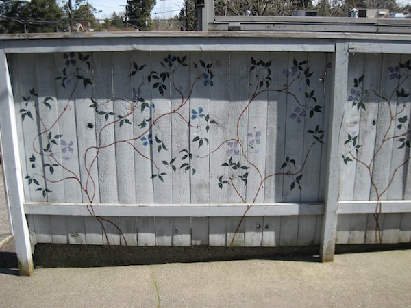 a Clematis mural on a fence in Seattle